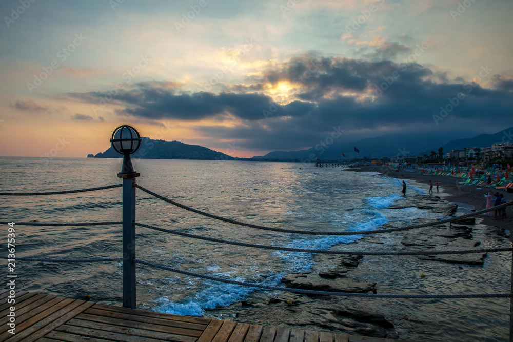 Fototapeta premium pier with lamp at sunset