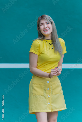Cool Asian hipsters girl wear yellow dress posing for take a photo,lifestyle of modern woman,Thai people in hippie style,Chill day for relax © reewungjunerr