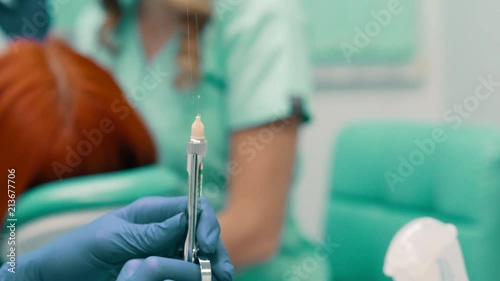 dentist prepares syringe for injection of anesthesia, close up photo