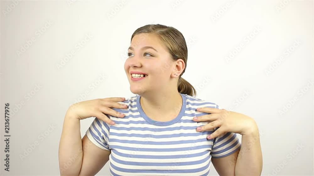 Brunette beautiful young woman, loudly speaking, wow, and smiling at the camera. Brunette beautiful young woman, loudly speaking, wow, and smiling at the camera.