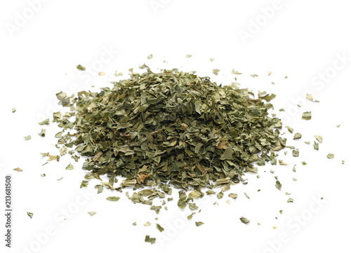 Pile celery spice, dried chopped leaves isolated on white