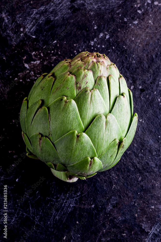 Obraz premium ARTICHOKE. Close up of artichoke, top view, dark background. Macro
