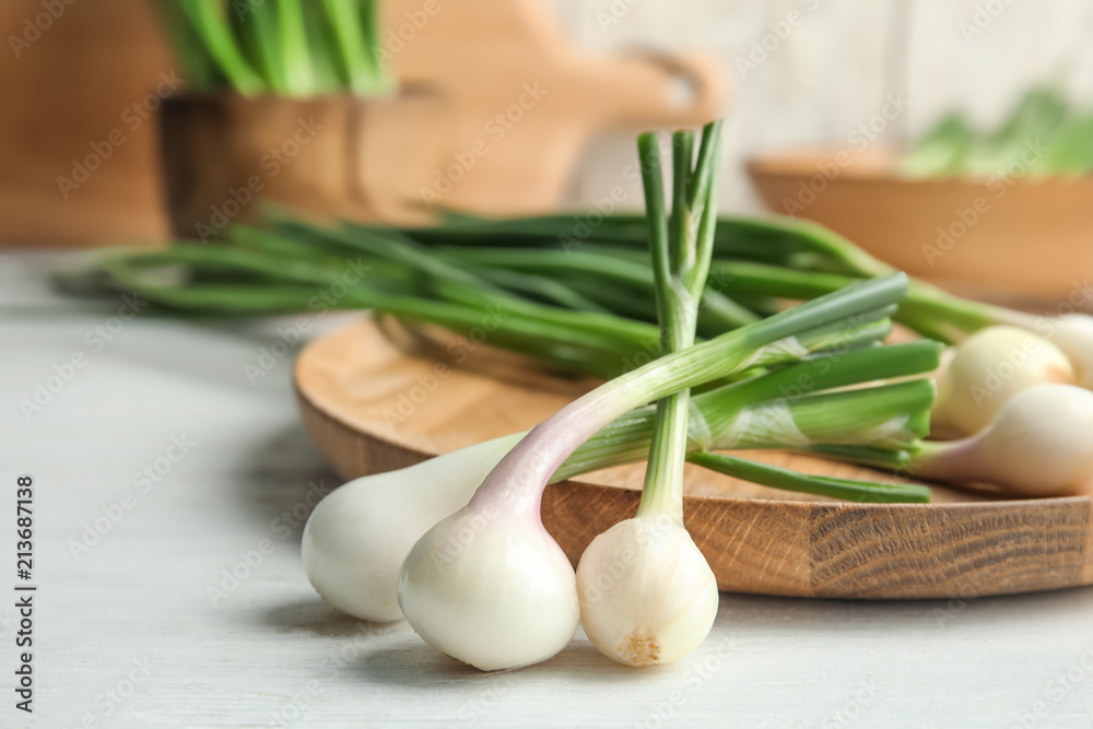 Fresh green onion on wooden table, closeup Fresh green onion on wooden table, closeup