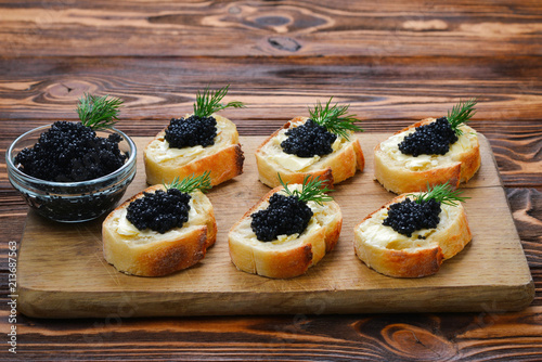 Toastes with black caviar. Spase for text or design.