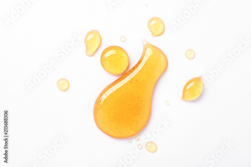 Papier peint Drops of sweet honey on white background, top view