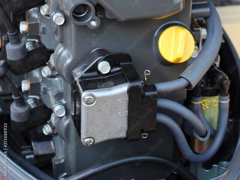 Fuel pump and oil filler neck of outboard boat motor close-up - engine maintenance, oil change