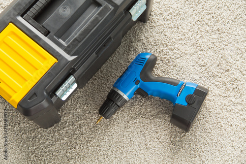 Closeup picture of toolbox and drill photo