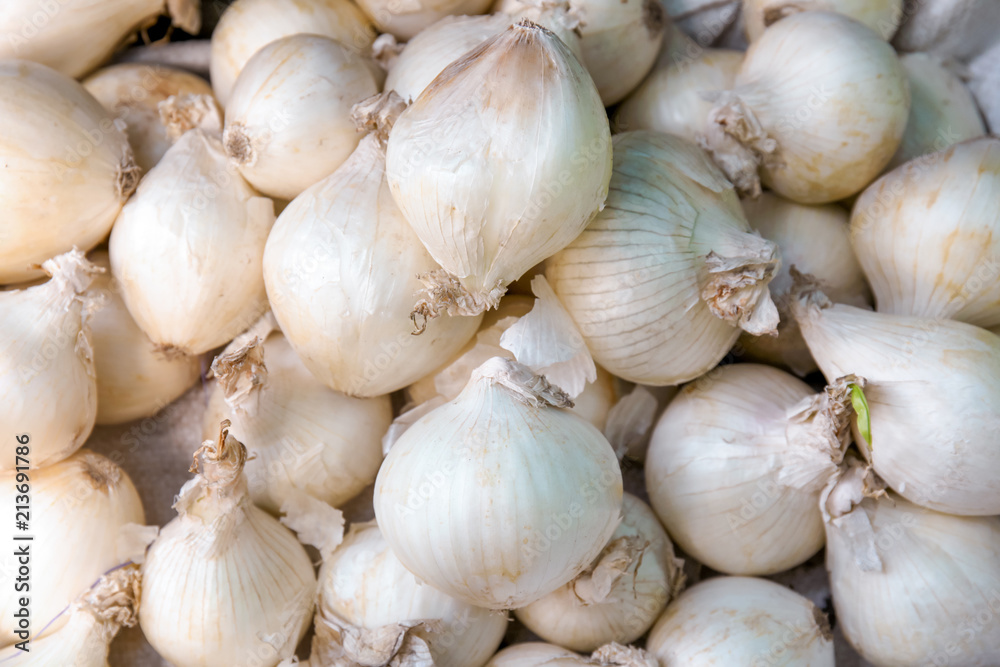 Pile of fresh ripe onions as background, closeup Pile of fresh ripe onions as background, closeup