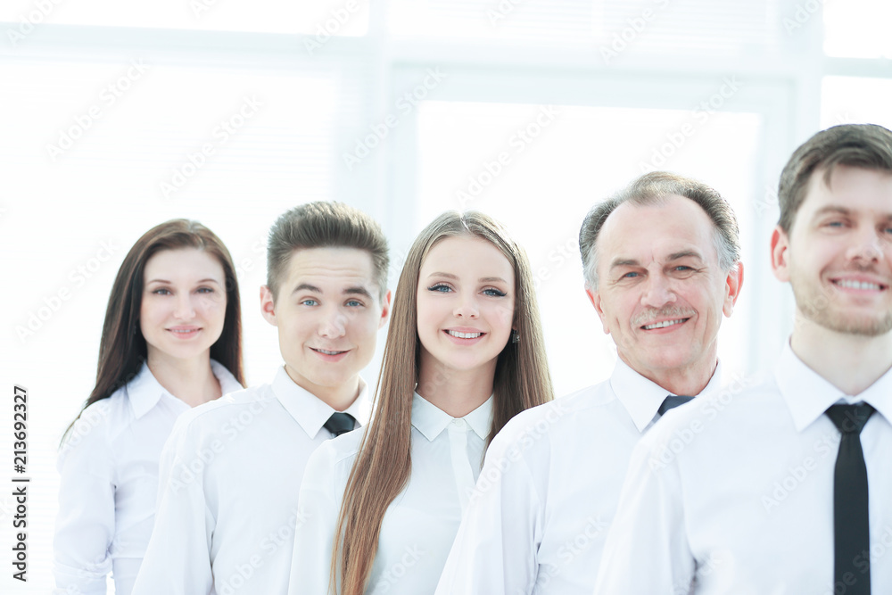 close up. a successful group of employees standing in a row close up. a successful group of employees standing in a row