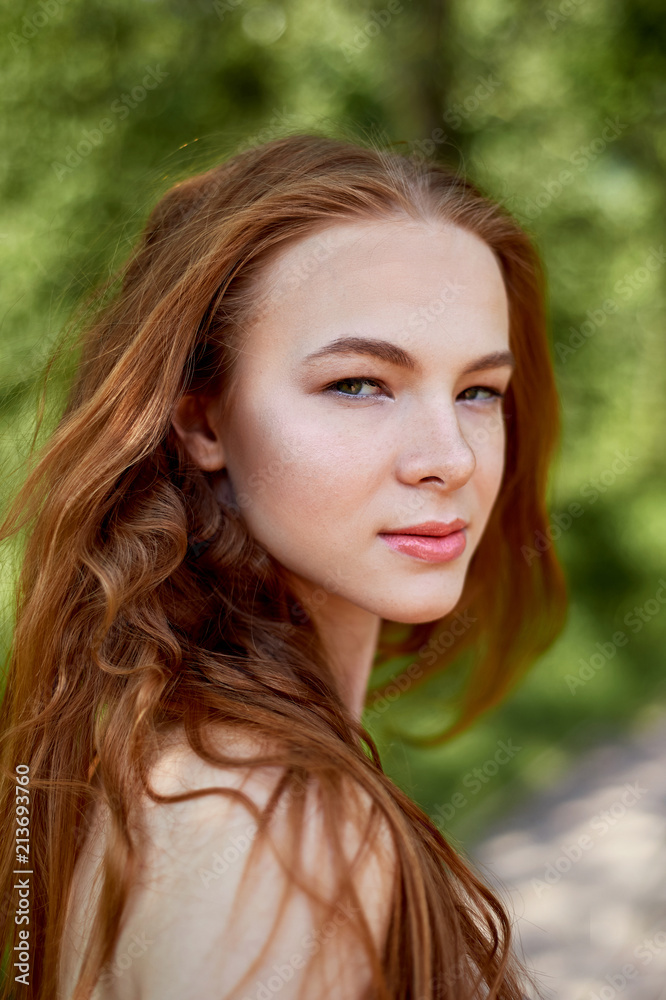 Portrait of a red-haired girl with long hair. Hair down. Artistic portrait. Child of nature. Proximity to naturalness and nature. A simple linen dress. Newton Portrait of a red-haired girl with long hair. Hair down. Artistic portrait. Child of nature. Proximity to naturalness and nature. A simple linen dress. Newton