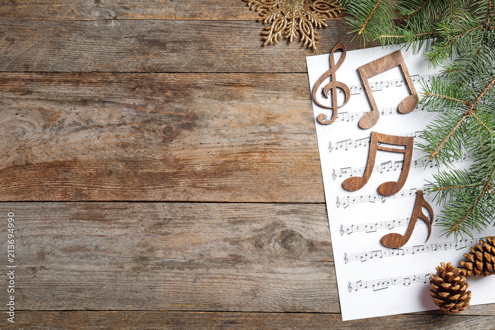 Composition with music sheet and notes on wooden background. Christmas songs  concept Stock Photo | Adobe Stock
