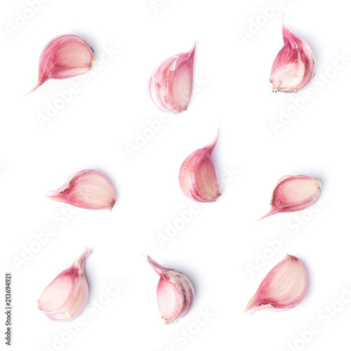 Nine garlic cloves isolated on white
