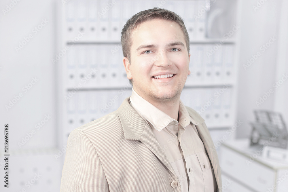 portrait of a young promising employee of the company. portrait of a young promising employee of the company.