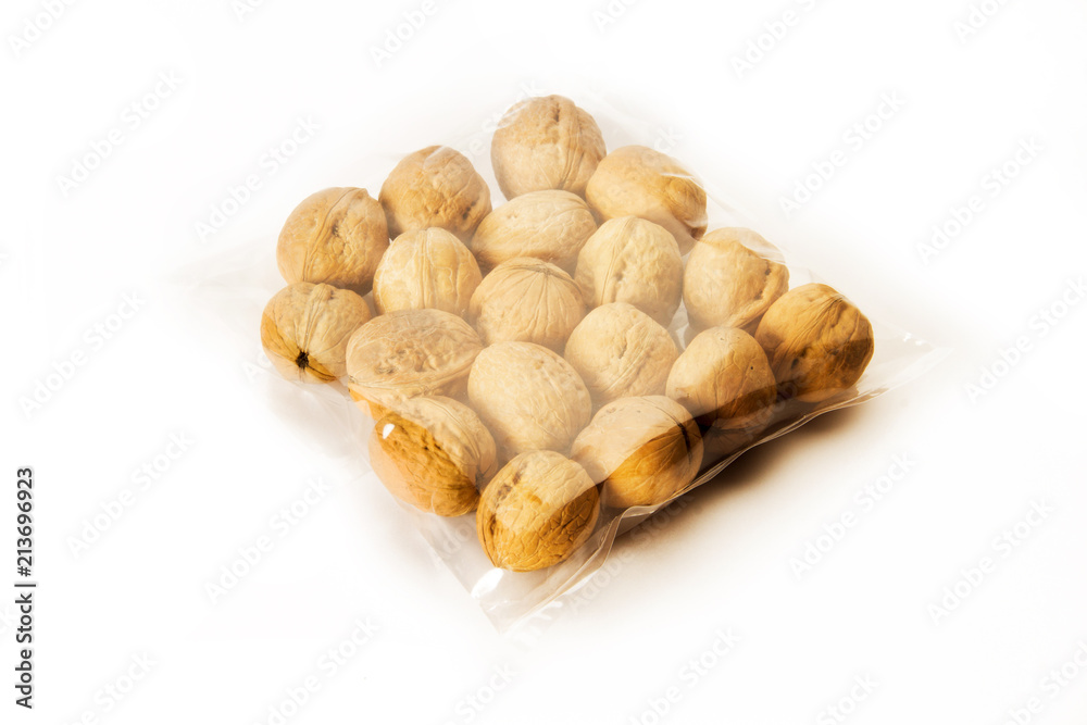 walnuts packed in plastic bag isolated on white background walnuts packed in plastic bag isolated on white background