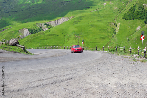 the car climbs the mountain road
