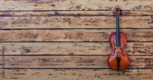 violin on an old wooden table