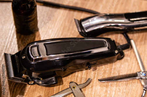 Closeup view of hairclipper and  barber tools. Equipment of barbershop photo