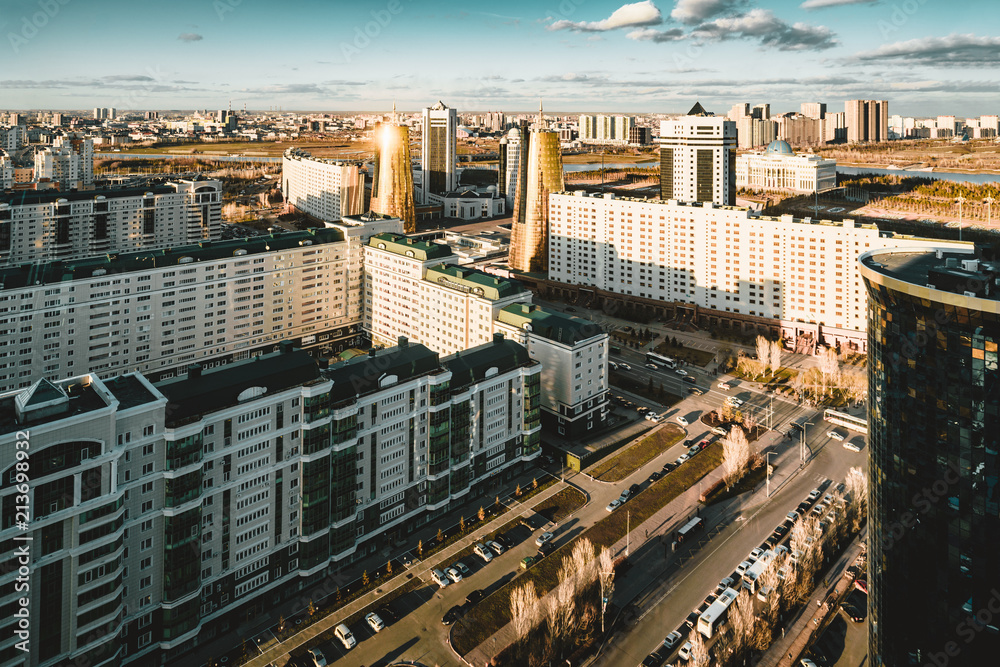 Obraz premium Sunset view towards Bayterek tower and hous of ministries in Astana Kazakhstan on a clear day
