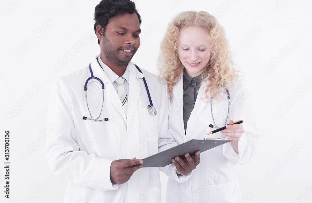 two doctors discussing medical records.isolated on white two doctors discussing medical records.isolated on white