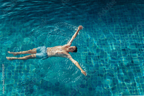 High angle view of man swimming in pool at resort