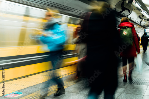People wait for Buenos Aires metro (Argentina) while others pass by quickly © simonmayer