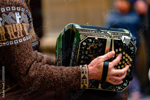 Close-up of street bandoneon player playing tango photo