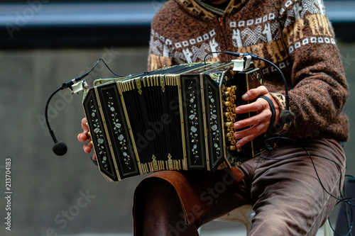 Fényképezés Close-up of street bandoneon player playing tango