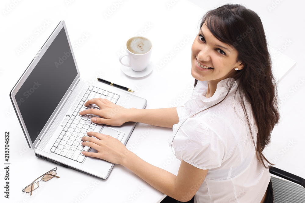 closeup. young employee sitting behind a Desk closeup. young employee sitting behind a Desk