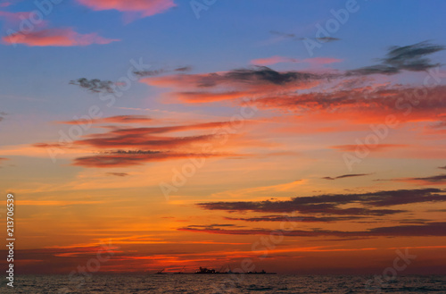 Fototapeta Naklejka Na Ścianę i Meble -  Sunrise in the waves of the sea. Sunset on the sea.