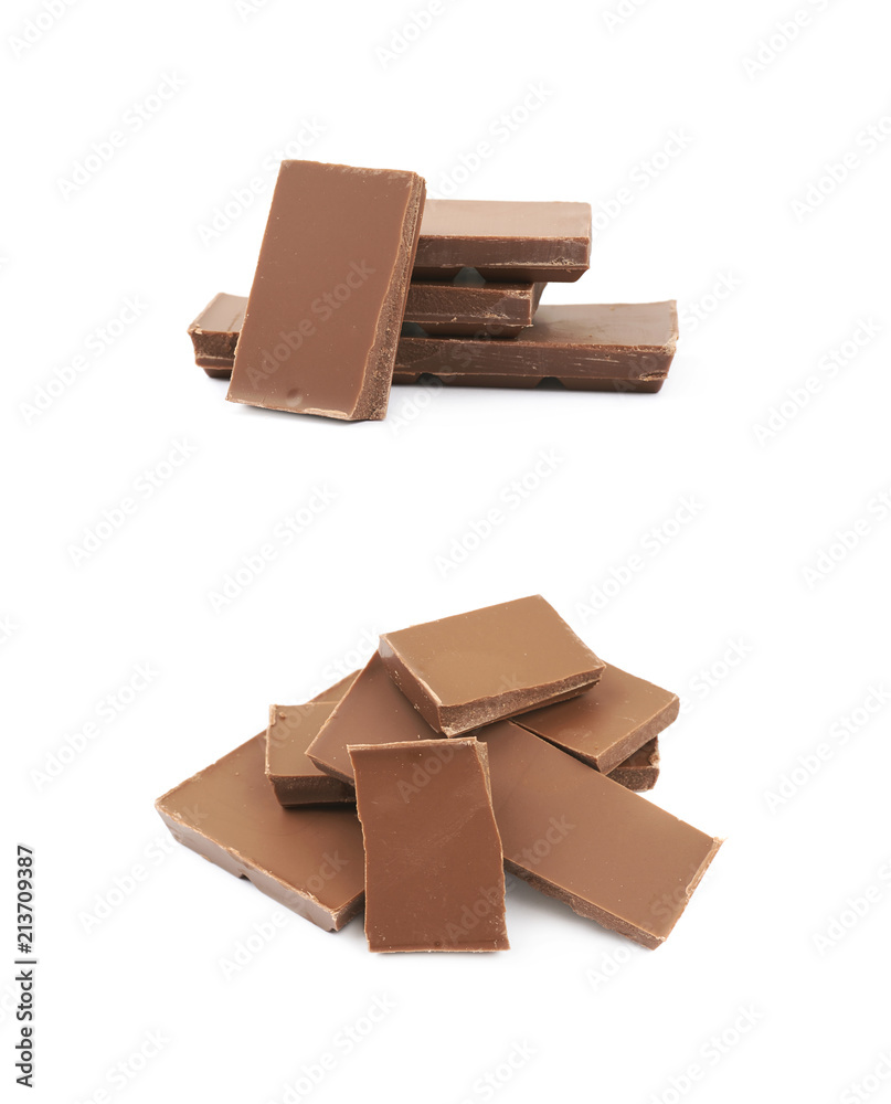 Pile of milk chocolate pieces isolated Pile of milk chocolate pieces isolated