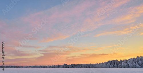 Colorful clouds in sky. Winter sunset.