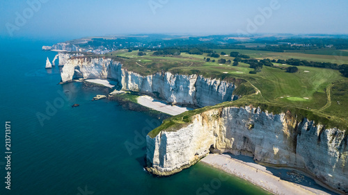 Drone view of seashore cliffs in Etretat France with a golf course