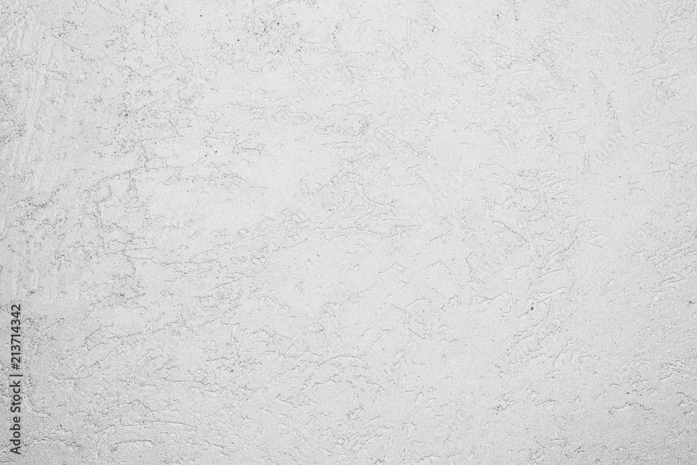 Fototapeta premium texture of the surface of the wall covered with decorative plaster of the woodworm type