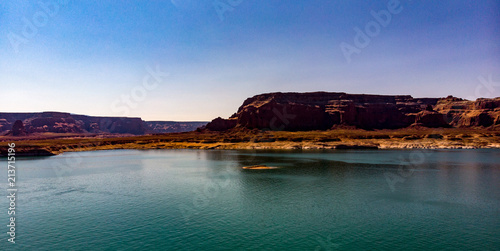 Aerial view of Lake Powell near Navajo Moutain  San Juan River in Glen Canyon with clear  beautiful skies  buttes  hills and water