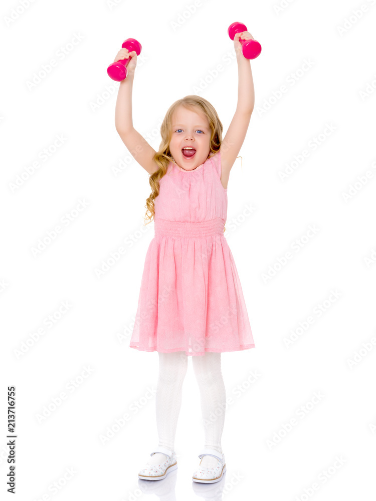 Little girl doing exercises with dumbbells. Little girl doing exercises with dumbbells.