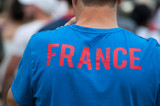  french supporter of football with the word france on tee shirt back during the giant screen projection of the final of the world cup france - croatia