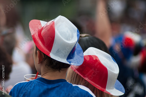  french supporter of football with the word france on tee shirt back during the giant screen projection of the final of the world cup france - croatia