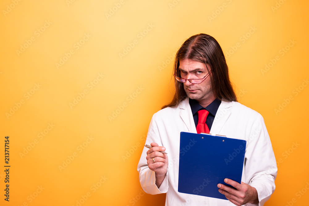 Profile portrait of male doctor raising an eyebrow Profile portrait of male doctor raising an eyebrow
