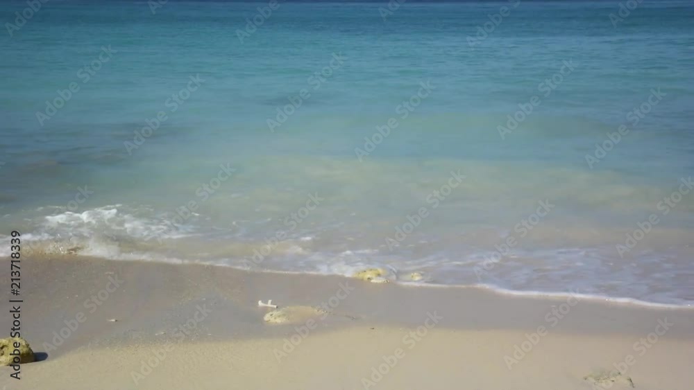 Straight on view of waves on an isolated beach in Colombia