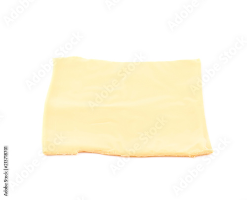 Slice of processed cheese isolated