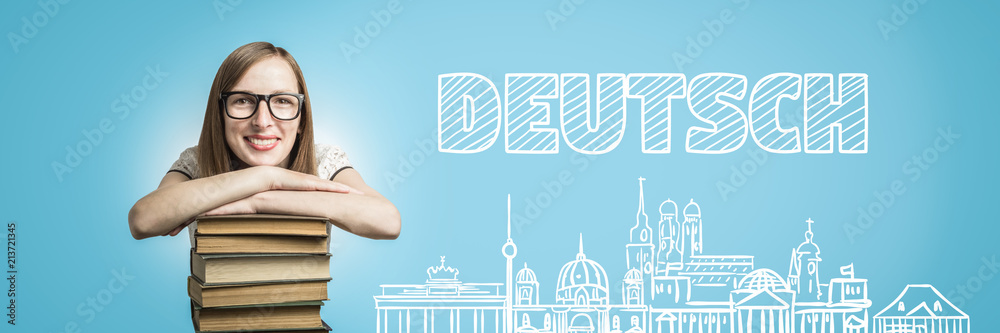 Young girl in a white dress, glasses, put her hands on a stack o Young girl in a white dress, glasses, put her hands on a stack o