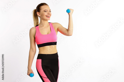 Young girl athlete, fitness with dumbbells isolated on white background