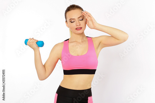 Young girl athlete, fitness with dumbbells isolated on white background