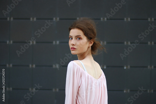 girl looked around with serious look and wind in hair