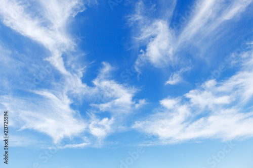 Beautiful blue sky over the sea with translucent, white, Cirrus clouds photo
