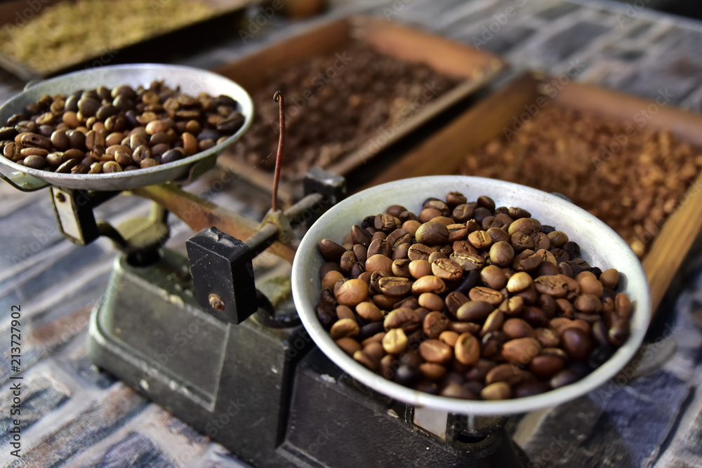 Untreated coffee beans on old scales