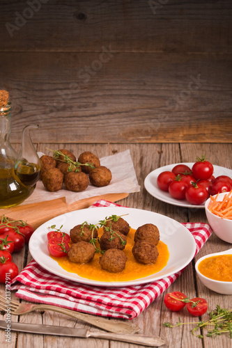 Meatballs with carrot purée.