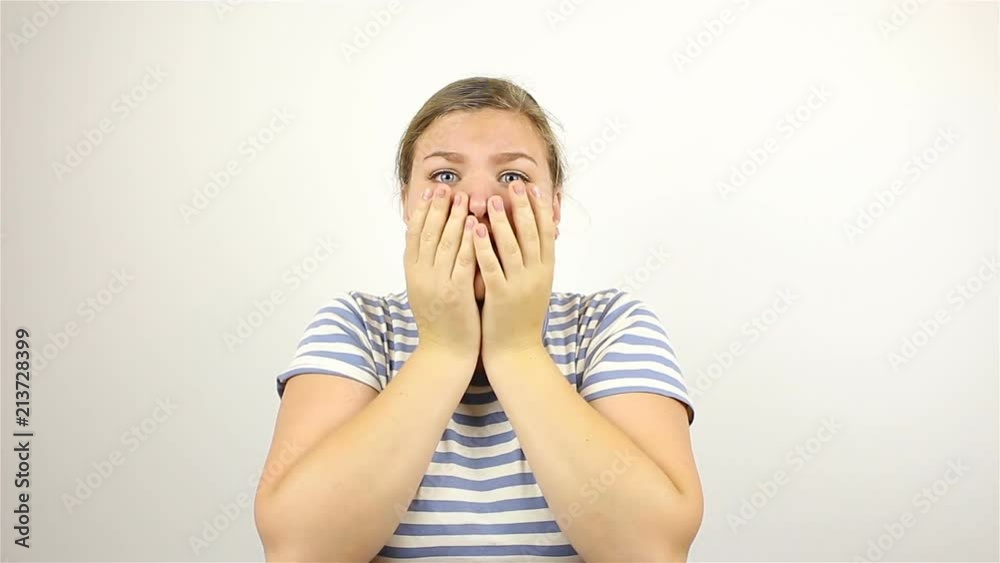 Portrait of a young beautiful woman. Frightened gesture Portrait of a young beautiful woman. Frightened gesture