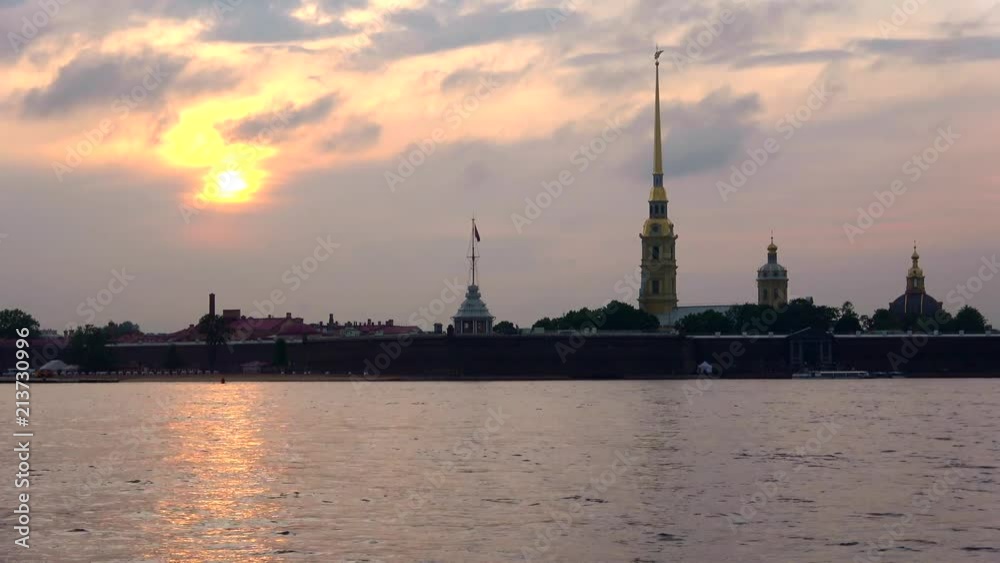Peter and Paul fortress on the background cloud sunset (timelapse). St. Petersburg, Russia