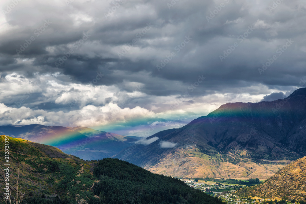 Fototapeta premium Rainbow in the mountains of Queenstown, South Island, New Zealand